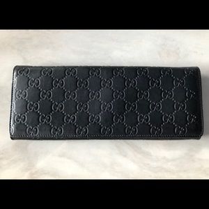 Authentic black leather Gucci clutch
